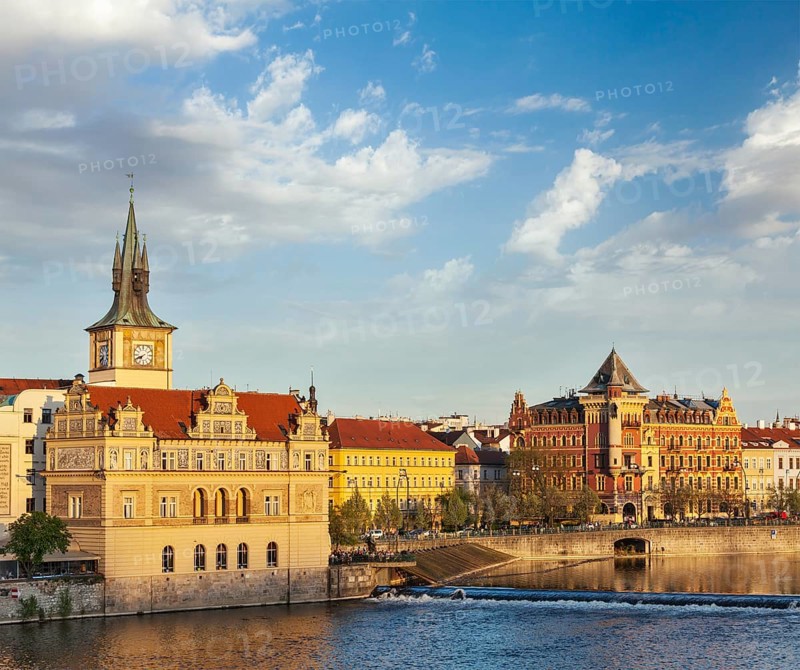 Prague Stare Mesto embankment view from Charles bridge on sunset. Prague