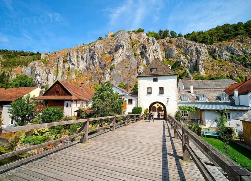 Old wooden bridge over the branch of the Altmuehl and Randeck Castle