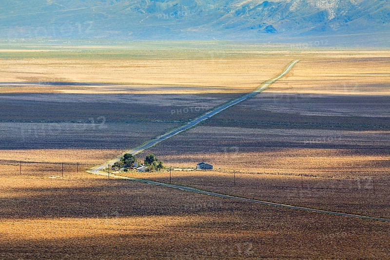 Lonely long road through desert landscape