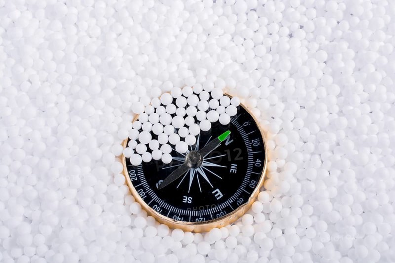 Compass on little white polystyrene foam balls