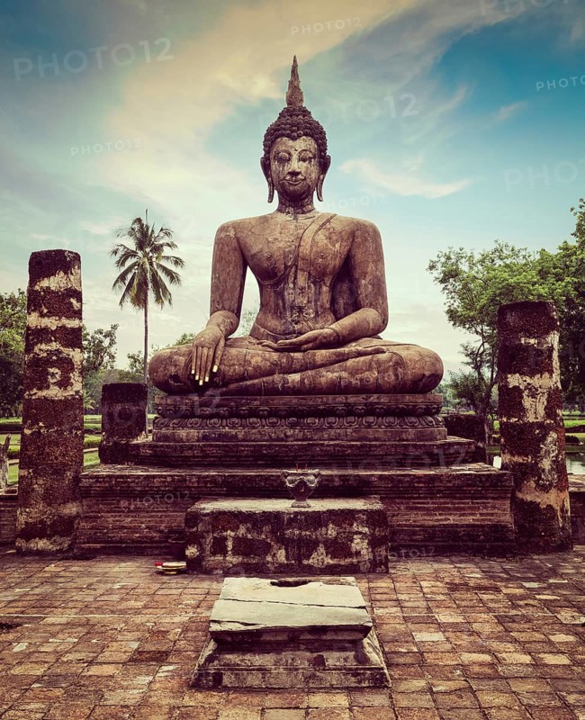 Vintage retro effect filtered hipster style travel image of Buddha statue hand close up detail. Sukhothai