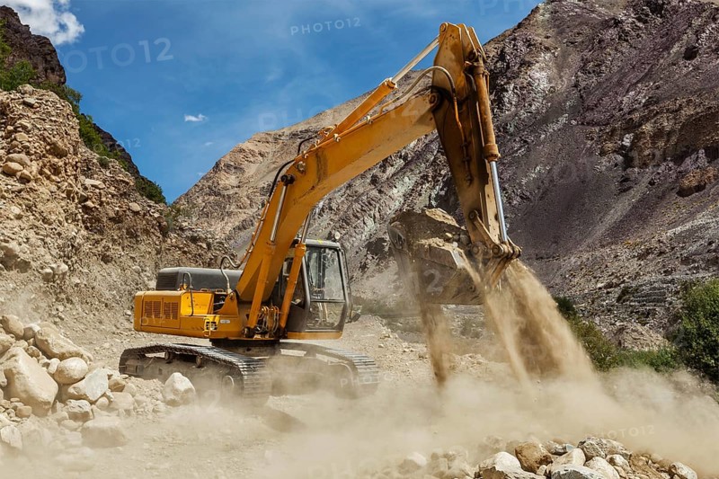 Excavator doing road construction in Himalayas. Ladakh