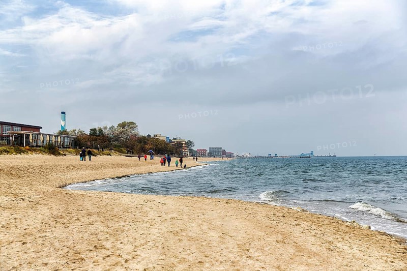 Strollers on the south beach in autumn