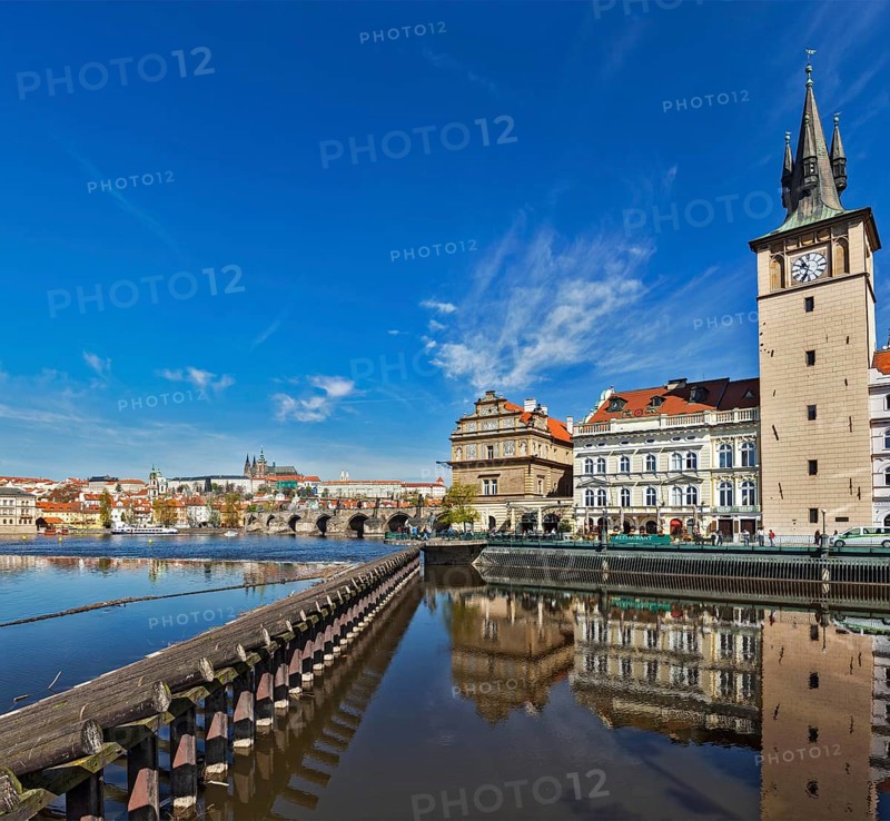 Prague Stare Mesto embankment view from Charles bridge on sunset. Prague