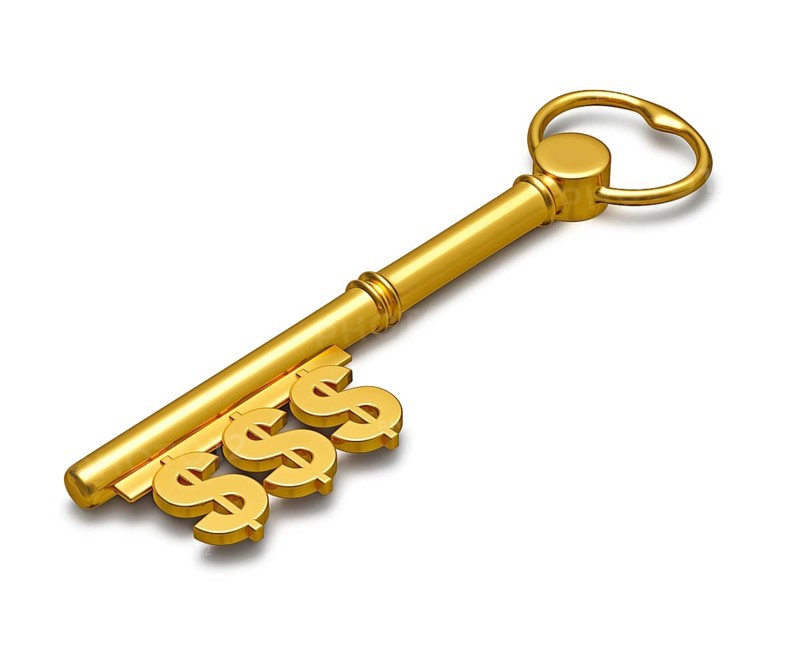 Key to Wealth with dollar signs isolated on white
