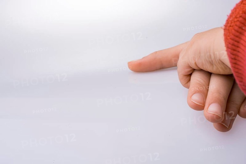 Child and grown up hands together on a white backgkround