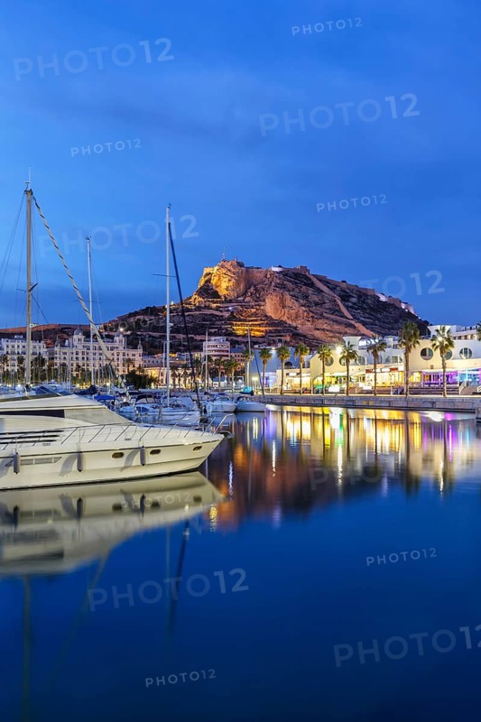 Port of Alicante at night Port dAlacant Marina with boats and view of Castillo Castle Holiday travel city in Alicante