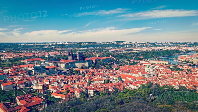 Vintage retro hipster style travel image of aerial panorama of Hradchany: the Saint Vitus