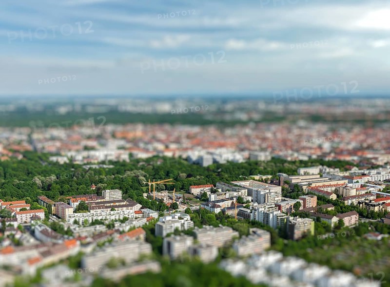 Aerial view of Munich from Olympiaturm Olympic Tower with tilt shift toy effect shallow depth of field. Munich