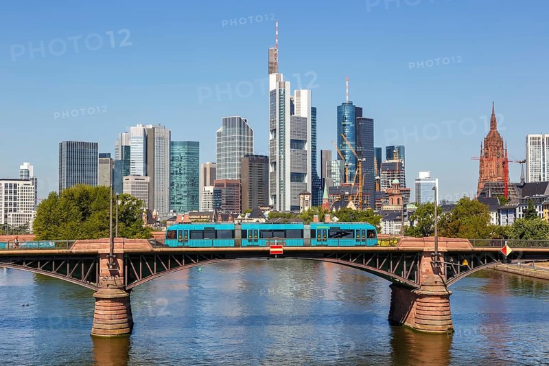 Skyline with river Main and light rail on Ignatz Bubis bridge Travel in Frankfurt
