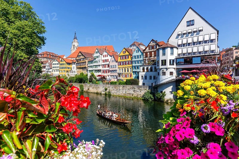 City on the Neckar River with punting boat in Tuebingen