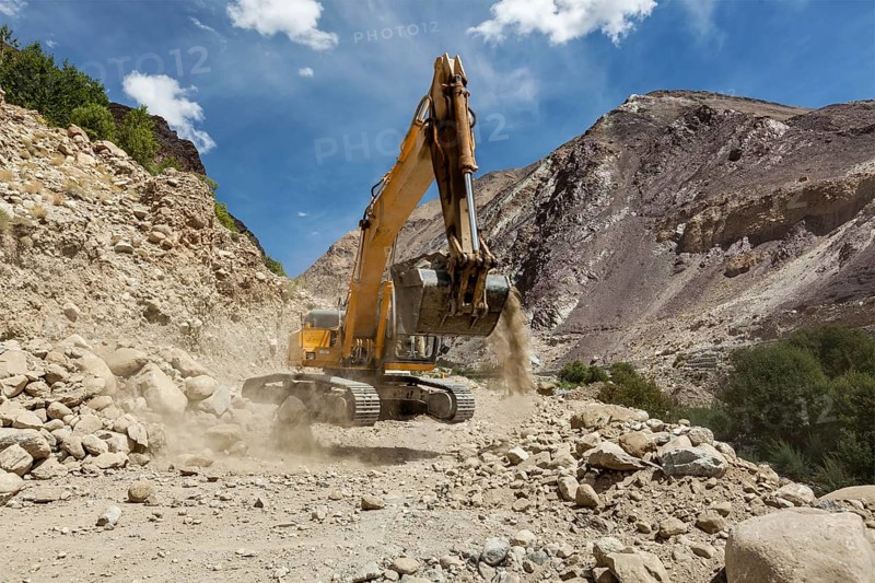 Excavator doing road construction in Himalayas. Ladakh