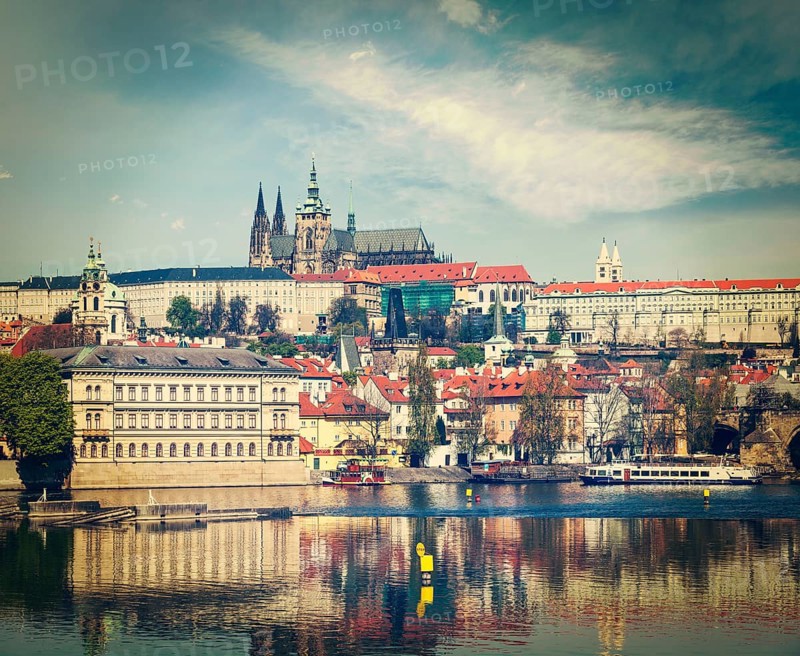 Vintage retro hipster style travel image of Charles bridge over Vltava river and Gradchany