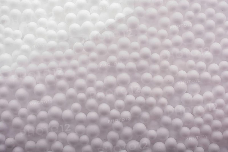 White little polystyrene foam balls as background