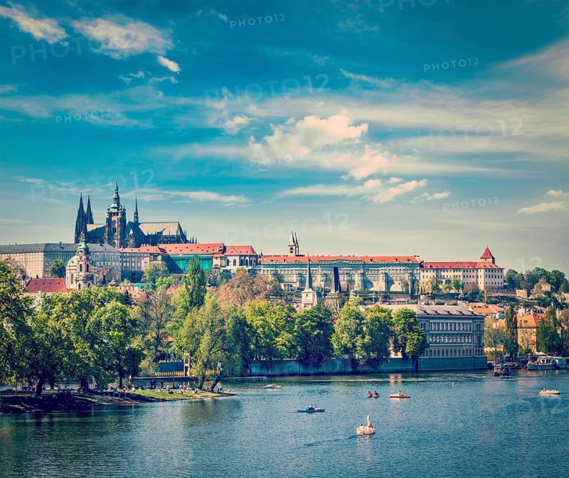 Vintage retro hipster style travel image of panorama view of Vltava river and Gradchany