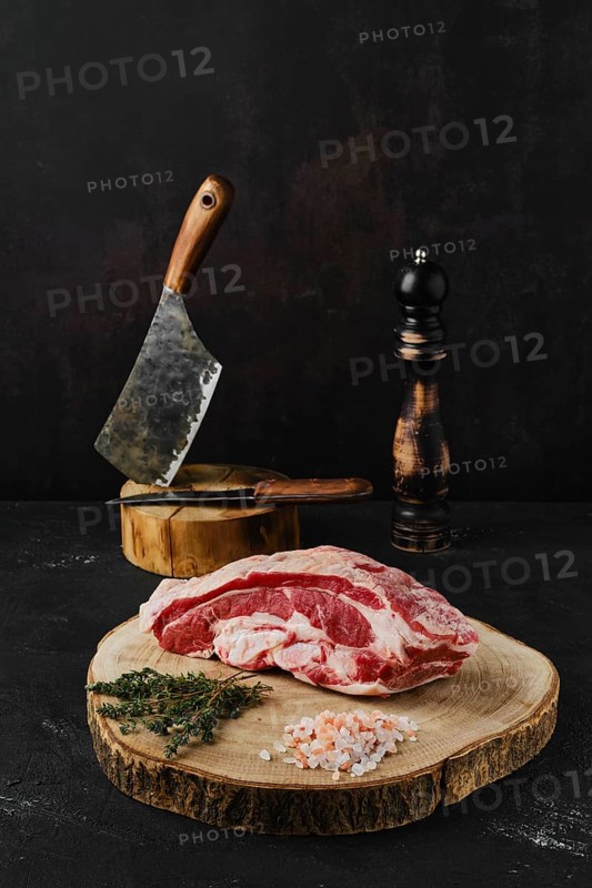 Raw beef brisket on wooden cutting board
