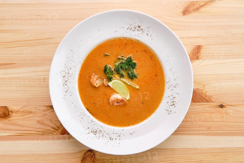 Shrimp soup on wooden table
