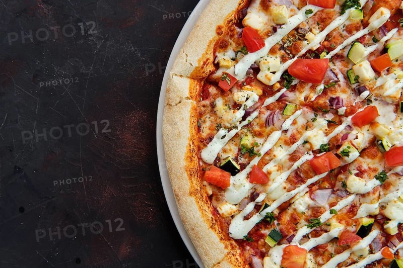 Close up view of pizza with feta
