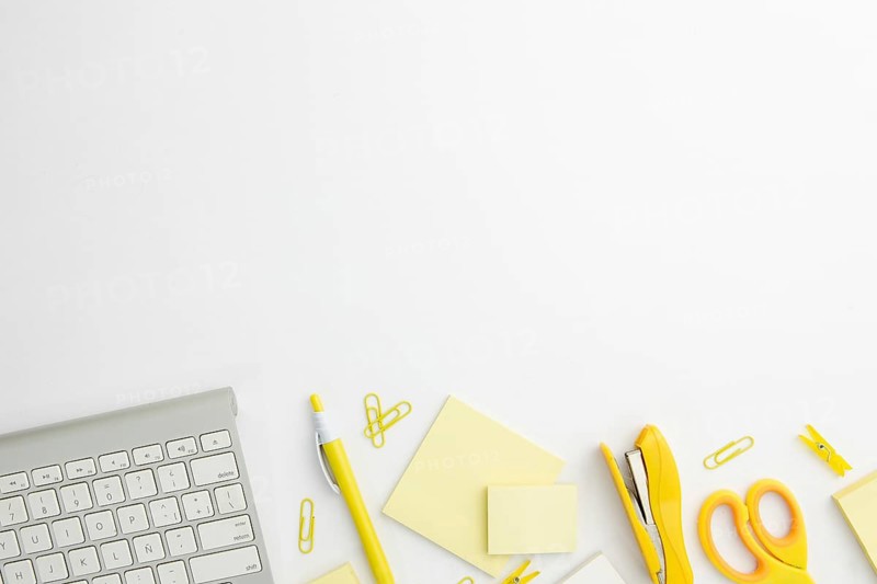 Flat lay stationary arrangement desk with yellow supplies