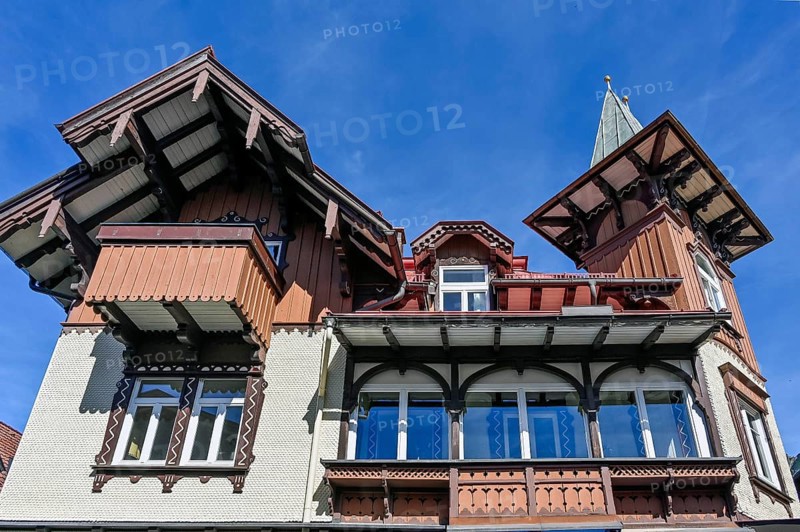 Classic timber building with wooden shingle facade