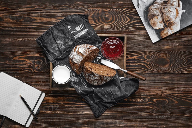 Fresh rye brown bread on wooden cutting board