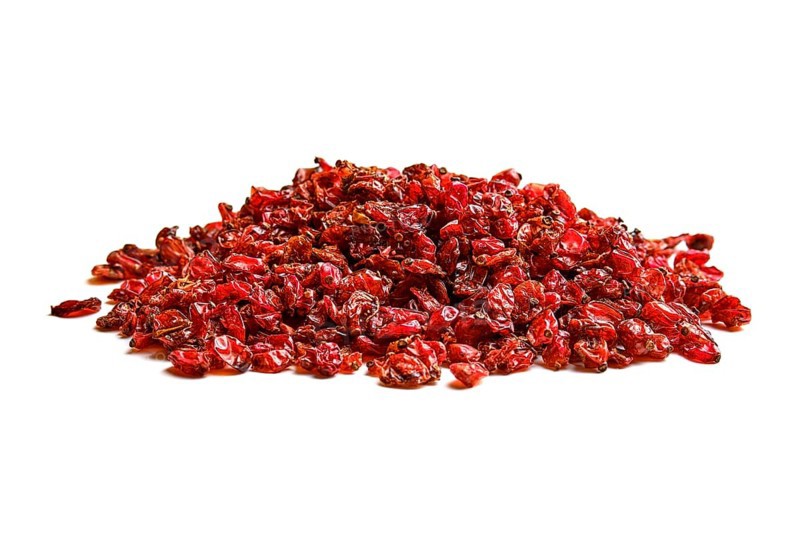 Heap of dry barberry on white background