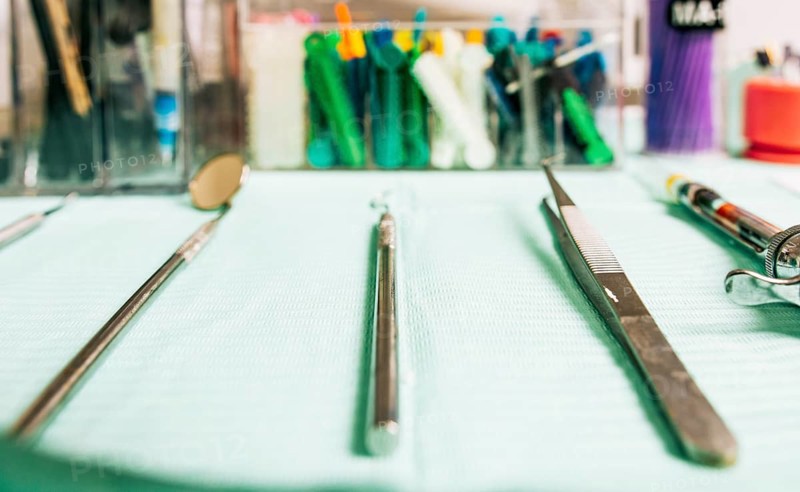 Stomatologist tools close-up on table. Set of dental tools on dentist's panel. Close up of dental tools on dentist's table