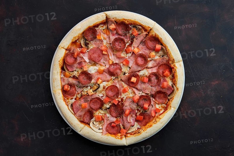 Top view of pizza with ham