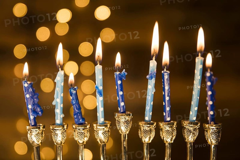 Small candles menorah near abstract lights. Resolution and high quality beautiful photo