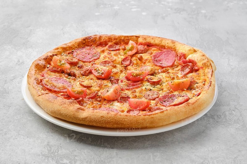 Pizza pepperoni with two kind of sausages on a plate