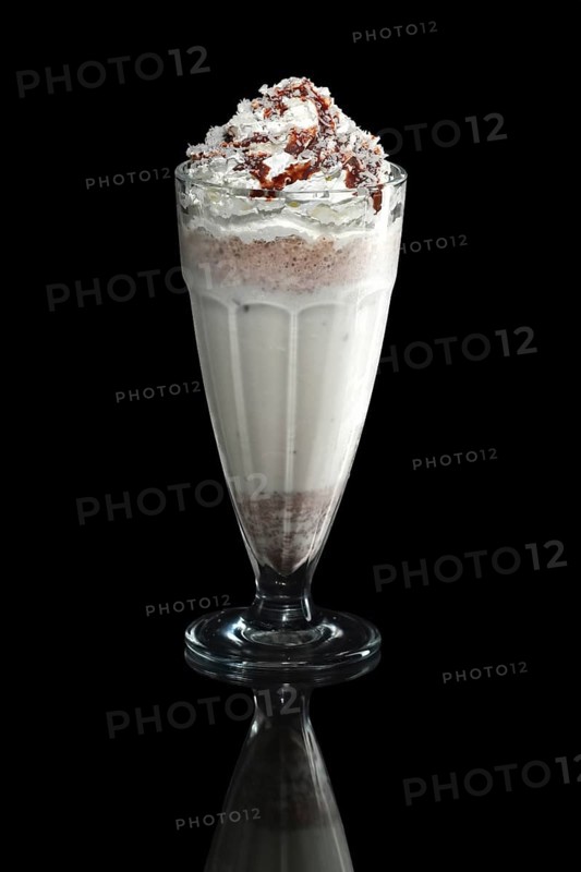 Milkshake caramel summer cocktail isolated on black