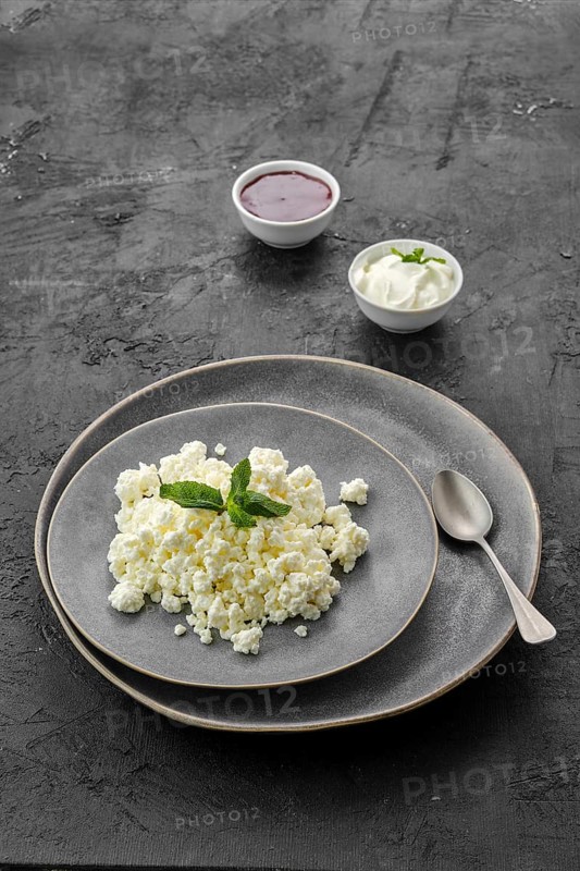 Fresh homemade cottage cheese on a plate