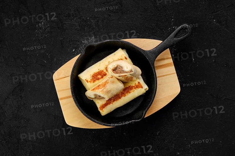 Thin pancakes stuffed with beef meat