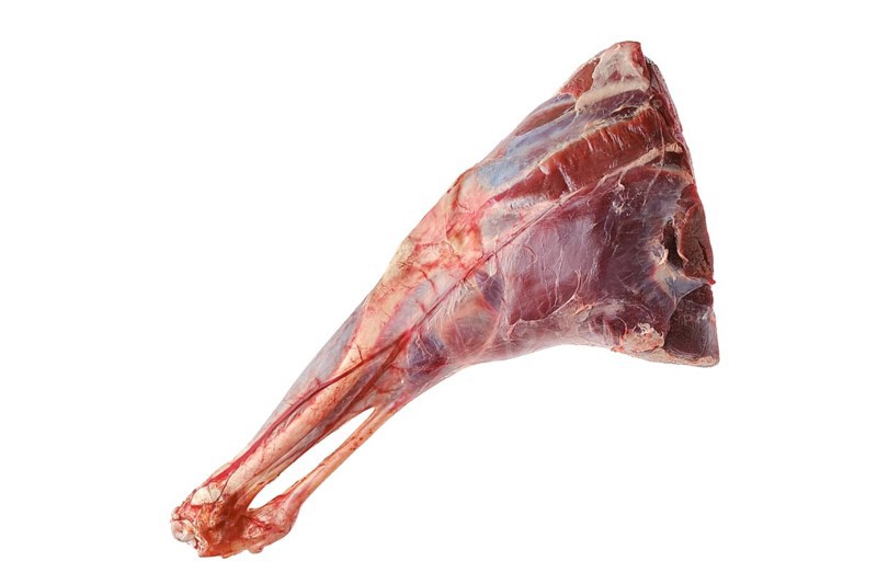 Raw fresh young beef leg isolated on white background