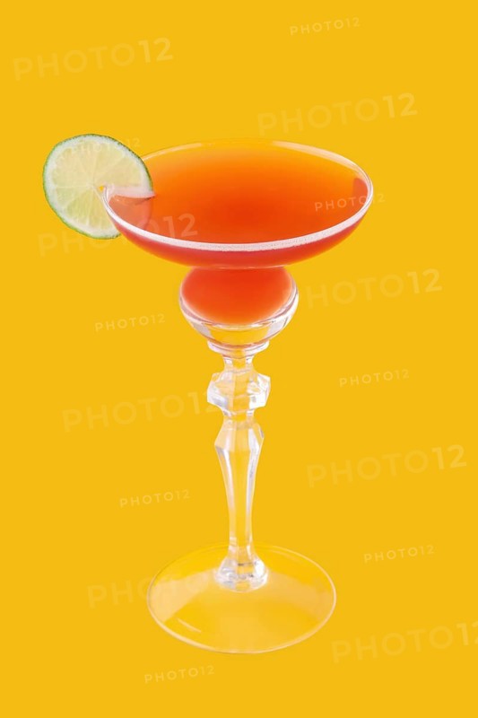 Cosmopolitan cocktail on yellow background