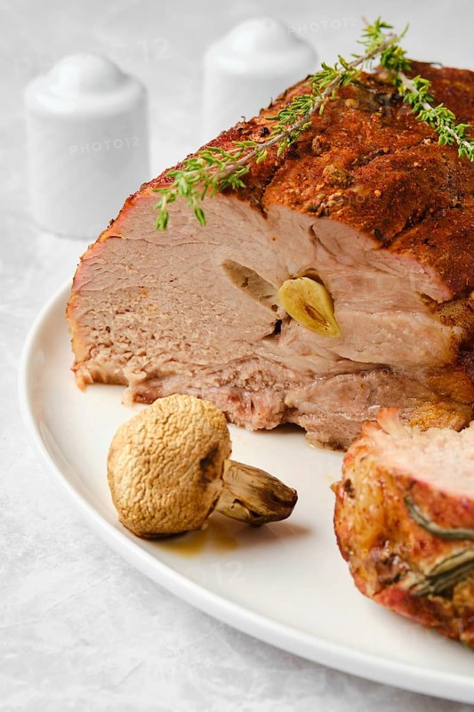 Pork neck baked in oven and cit on slice closeup