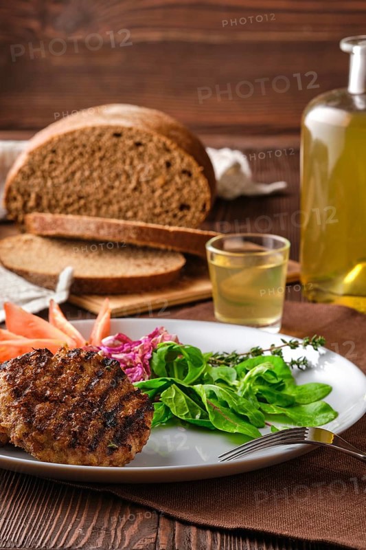 Grilled beef cutlet with fresh salad