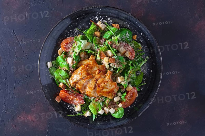 Fried turkey fillet with arugula