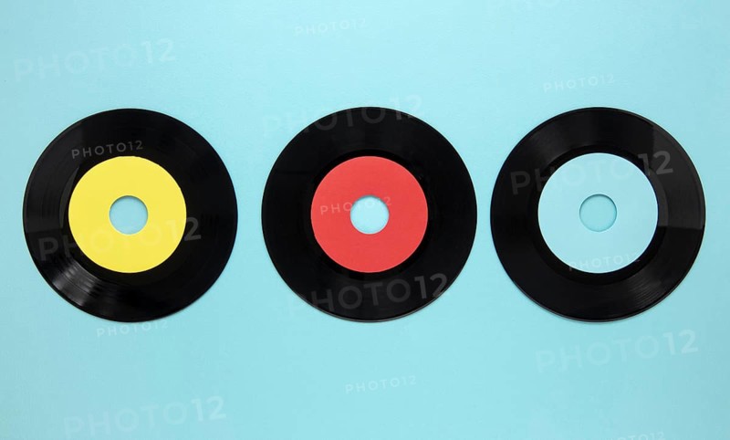 Flat lay old disc records blue background