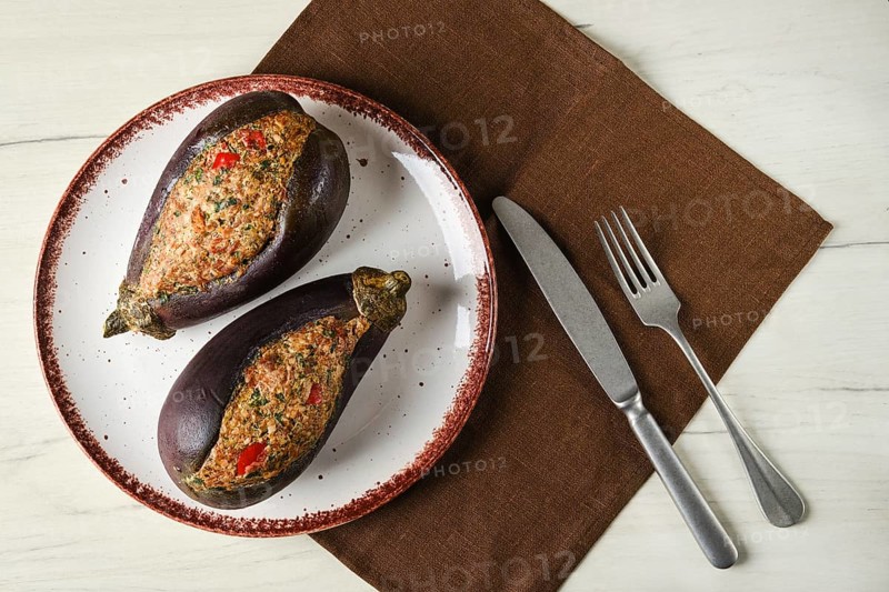 Overhead view of semifinished aubergine with meat and spice filling