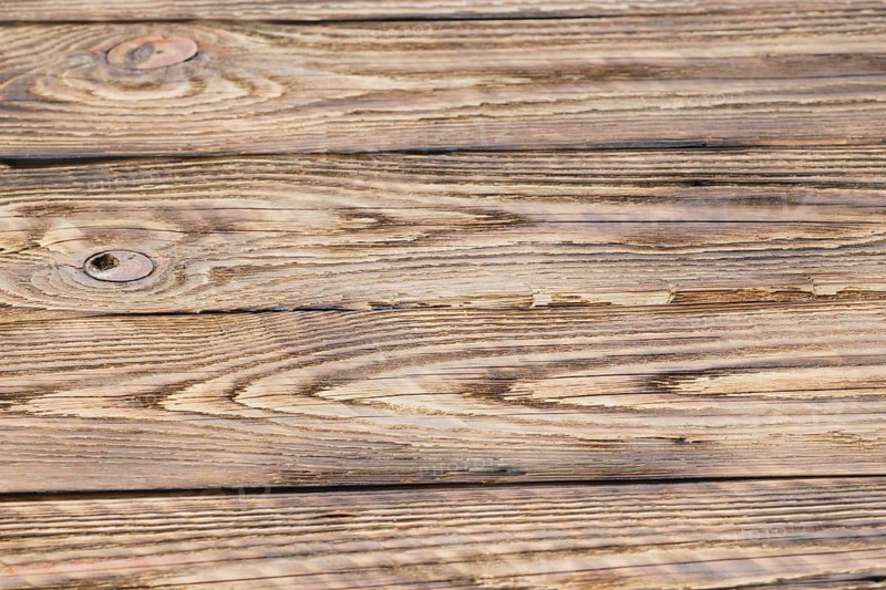 Soft focus photo of old partly burned wooden background