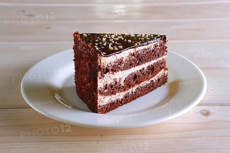 Layered chocolate cake. Biscuit dough with cream