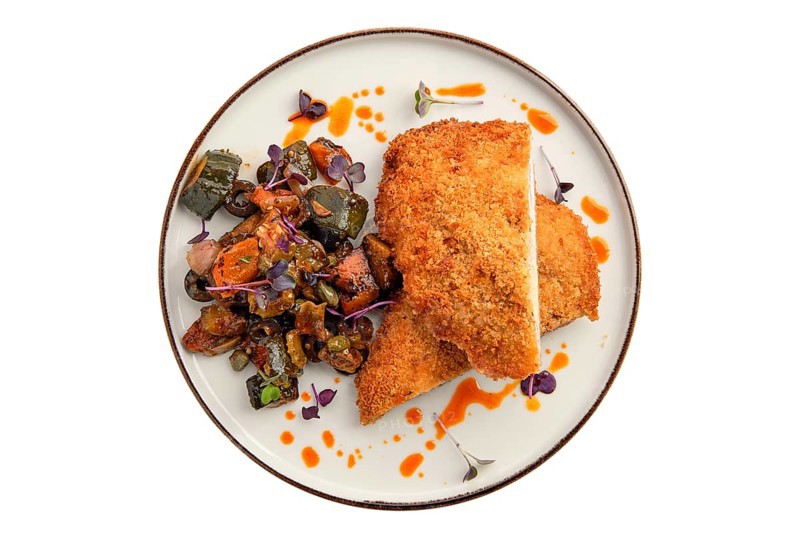 Cutlet with stuffing in breading with fried eggplant