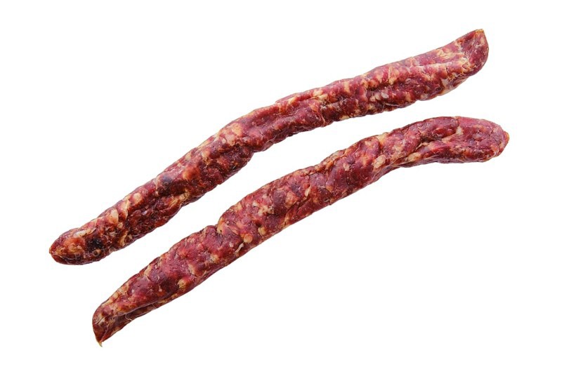Top view of sun-dried pork sausage isolated on white background