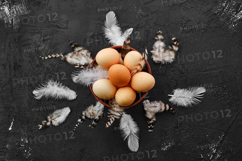 Fresh country eggs in clay bowl