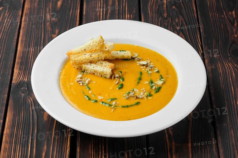Aubergine soup puree with pumpkin seed and crouton