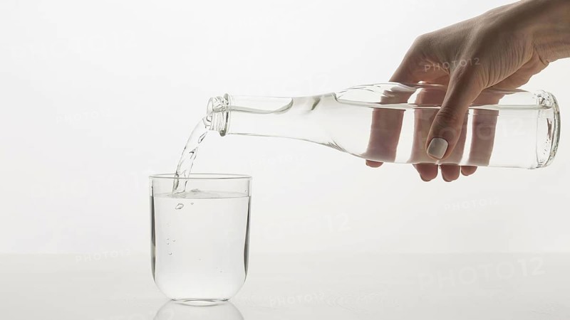 Person pouring water glass. Resolution and high quality beautiful photo