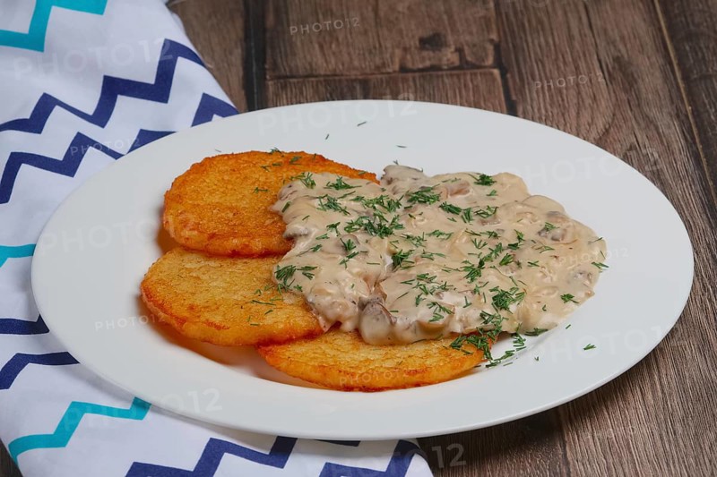 Potato pancakes with mushroom sauce