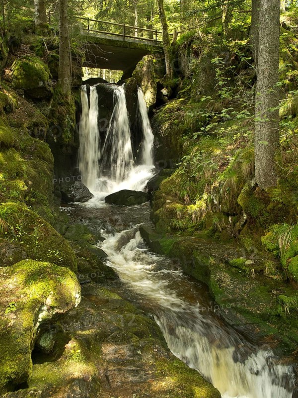 Waterfall and bridge in the gorge of the Menzenschwander Alb