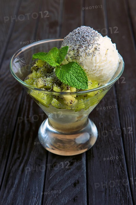 A cup of apple ice cream decorated with kiwi